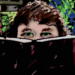 Digital image of author behind a book